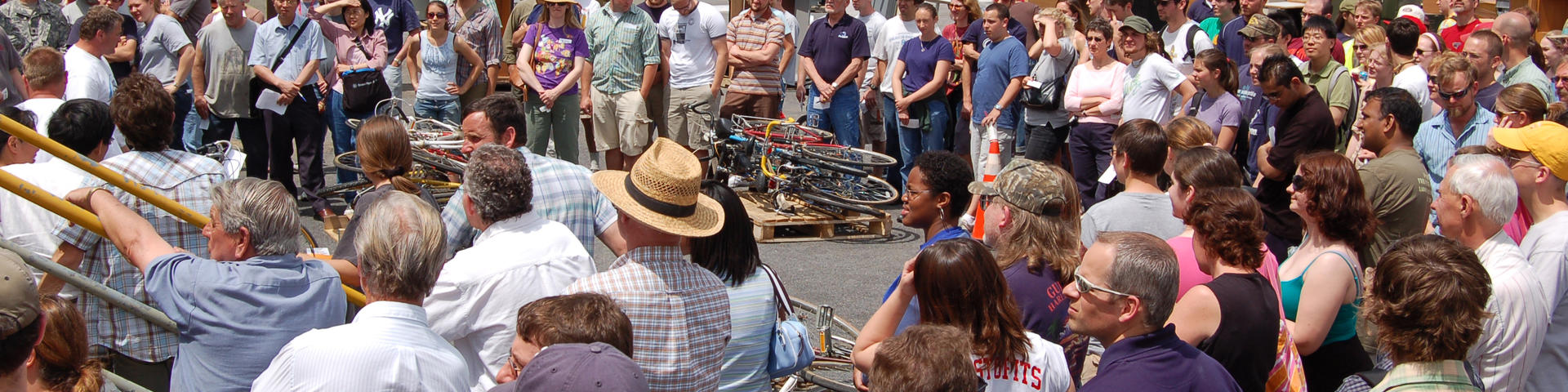 Lion Surplus auction with a lot of people standing around and bikes up for auction